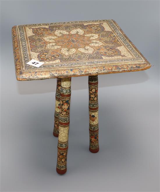 A 19th century Kashmiri painted wood tripod table height 36cm